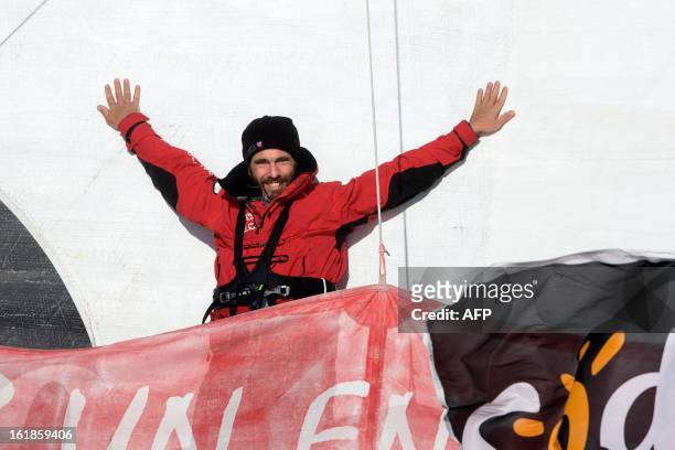 French skipper Tanguy de Lamotte celebrates on his monohull "Initiatives Coeur" - Mecenat Chirurgie Cardiaque as he finished tenth in the 7th edition...