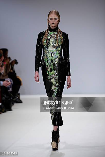 Model walks the runway at the Dans la Vie show during London Fashion Week Fall/Winter 2013/14 at Freemasons Hall on February 16, 2013 in London,...