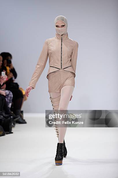 Model walks the runway at the Dans la Vie show during London Fashion Week Fall/Winter 2013/14 at Freemasons Hall on February 16, 2013 in London,...