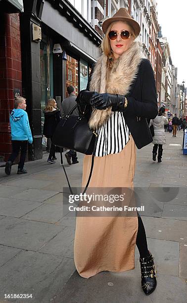 Laura Harby, dancer wearing a black Zara jacket, two tone black and white stripe Zara blouse over beige Maxi Zara skirt, accessorised with a H & M...