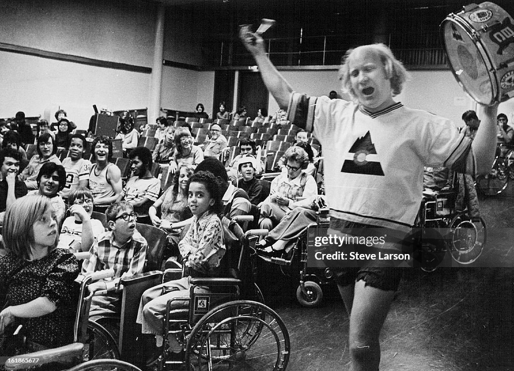 MAR 8 1976, MAR 9 1977; Krazy George Whoops It Up For March Of Dimes; Official cheerleader of the Co