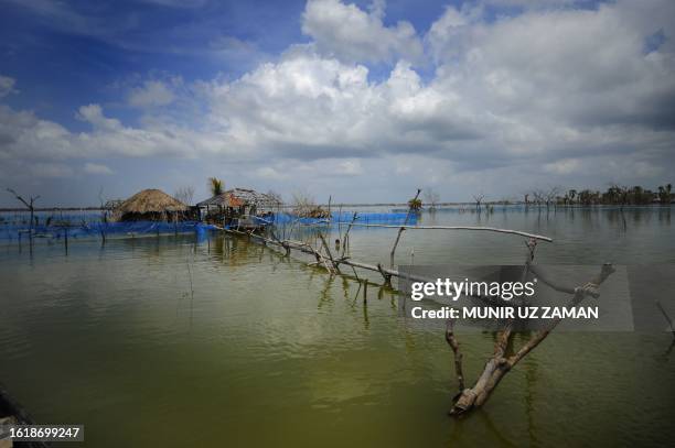 Flooded homes areseen during tidal movements in Koyra on August 8, 2010. Cyclone Aila slammed into southern Bangladesh on May 26 and while the...