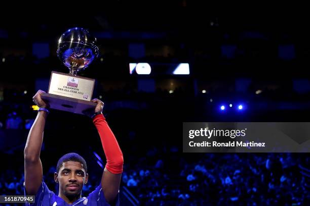 Kyrie Irving of the Cleveland Cavaliers celebrates after winning the Foot Locker Three-Point Contest part of 2013 NBA All-Star Weekend at the Toyota...