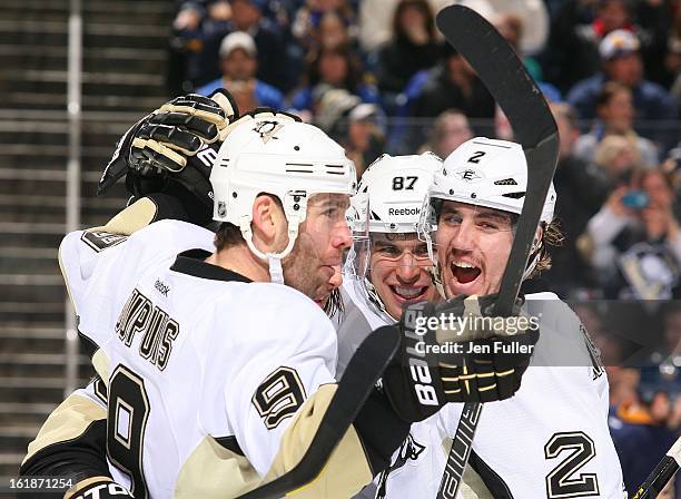 Pascal Dupuis of the Pittsburgh Penguins celebrates his third period goal with teammates Sidney Crosby and Matt Niskanen against the Buffalo Sabres...