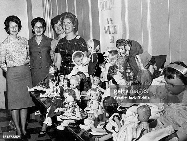 Members Of Wednesday Y-Wives Display Dolls Soon To Be In Santa Shop; They are, left to right, Mrs. Alvin Krutsch, Mrs. Donald Bogart, Mrs. Robert...