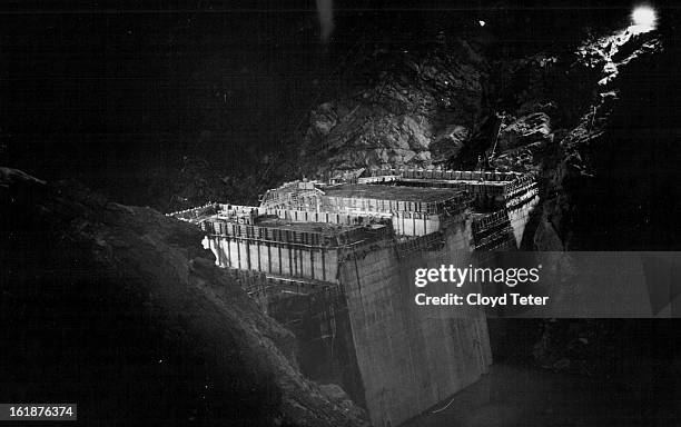 Powerful flood lights illuminate the massive concrete lower section of Denver's Dam 22 in south Boulder canyon as workmen labor through the night on...