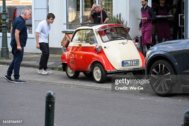 bmw isetta classic car at the luegallee in duesseldorf - oberkassel - isetta car stock pictures, royalty-free photos & images