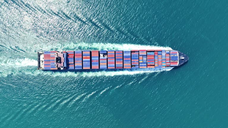 https://media.gettyimages.com/id/1618767065/video/top-view-of-cargo-container-ship-cargo-vessel-ship-carrying-container-and-running-for-import.jpg?b=1&s=640x640&k=20&c=KW9wg-LaJxX667E9-HLZh8O_J6PRKbjs45QT0WzB8Zs=