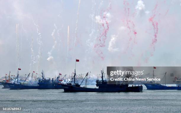 Fishermen set off fireworks on fishing boats before setting sail for fishing on August 16, 2023 in Fuzhou, Fujian Province of China. The annual...