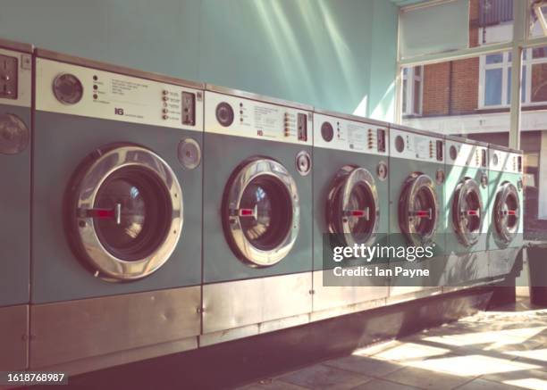 laundromat launderette - dry cleaners stock pictures, royalty-free photos & images