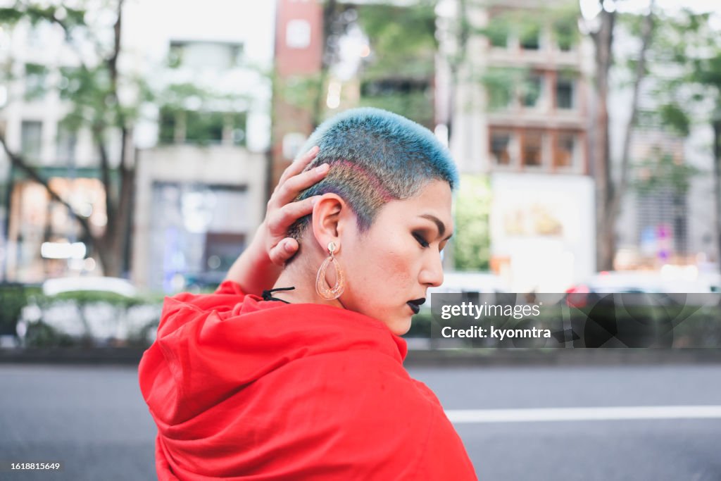 Portrait Of Transgendered Person Eye Closed And Posing