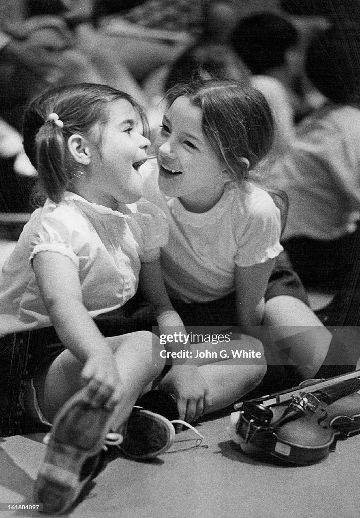 MAR 13 1972; Musicians Try A Little Relaxation; Tricia Franciosi, 5, left, and Debbie Coates, 7, tak