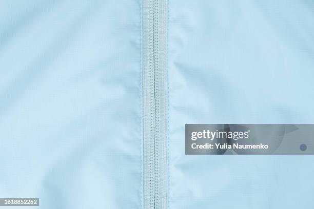 zipper on a quilted jacket. close-up of puffer jacket texture with zipper. - nylon stock-fotos und bilder