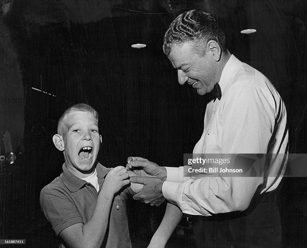 NOV 8 1963, NOV 13 1963; Ouch! Doc, That Hurts; Paul Witzen, 11, of 7508 Canosa Court, a sixth grade