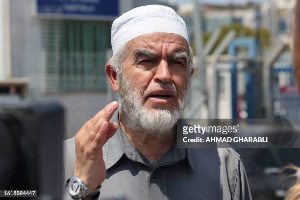 Sheikh Raed Salah, leader of the radical northern branch of the Islamic Movement in Israel, speaks on August 23 outside a police station during the...