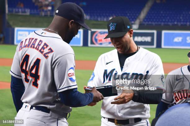 Yuli Gurriel of the Miami Marlins receives his World Series ring from the Houston Astros prior a game at loanDepot park on August 15, 2023 in Miami,...
