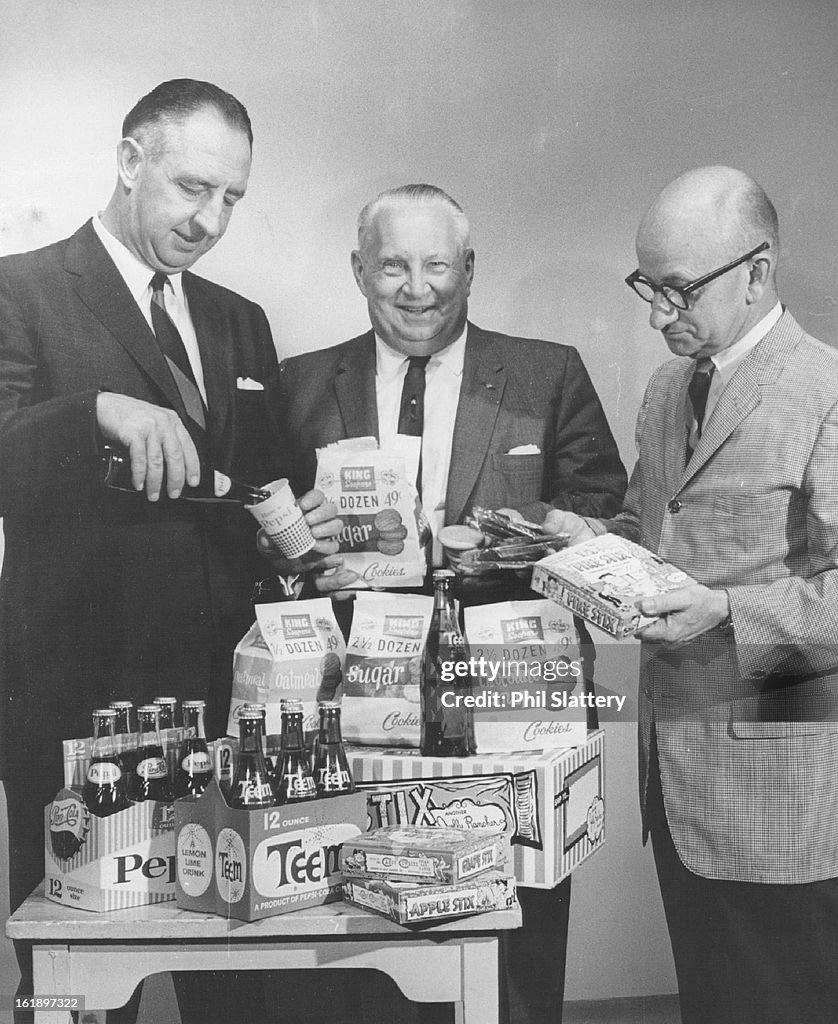 AUG 1963, AUG 11 1963; Treats are Ready for Kid's Fishing Derby; From left are James Gooding, presid