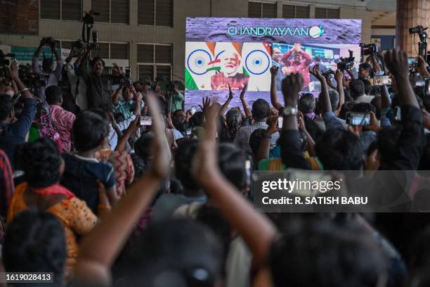 People celebrate the successful lunar landing of Chandrayaan-3 spacecraft on the south pole of the Moon, in Chennai on August 23, 2023. India became...