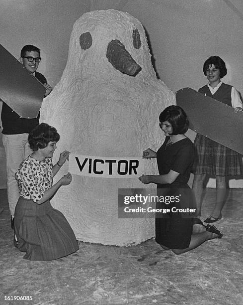 Temple Youths Build A Mascot; Young people of Temple Emanuel building a papier mache penguin mascot for a Thanksgiving conference are, from left,...