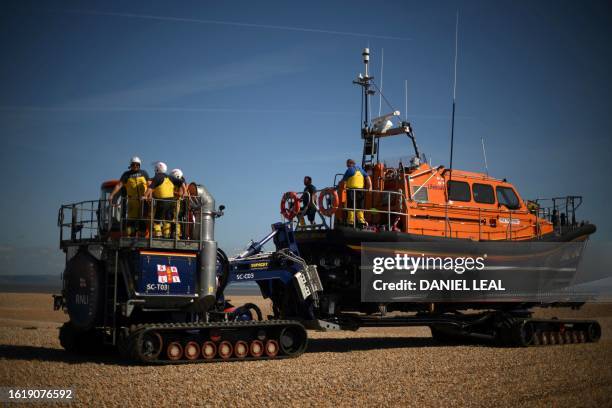 Royal National Lifeboat Institution lifeboat is pulled on a beach in Dungeness, southeast England, on August 23, 2023. More than 100,000 migrants...