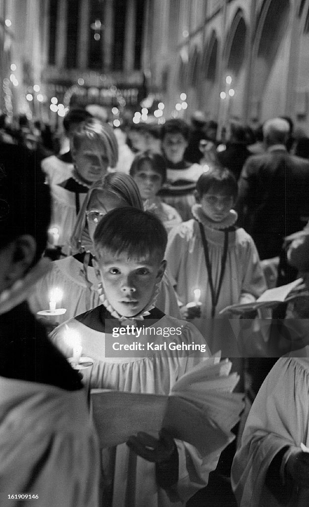 DEC 25 1986; The St. JohnT-(s Cathedral Boys and Girls' Choir exited the chapel holding candles afte