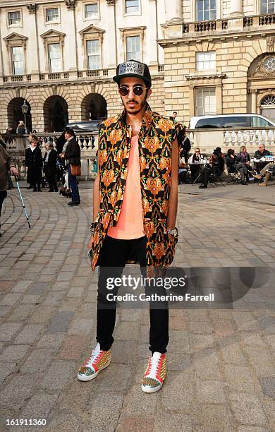 Abdulla Al-Abdulla of Qatar wears Opening Ceremony jacket by Kenzo, salmon coloured top by Urban Outfitters, 7 for All Mankind jeans, accessorised...