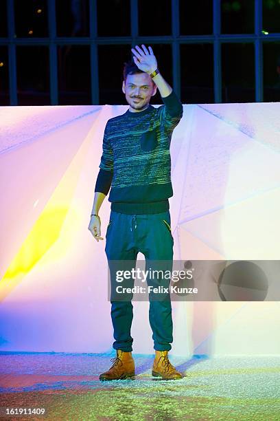 Designer Matthew Williamson appears on the runway at the Matthew Williamson show during London Fashion Week Fall/Winter 2013/14 at on February 17,...