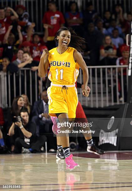 Player Candice Wiggins cheers during the NBA Cares Special Olympics Unity Sports Basketball Game on Center Court during the 2013 NBA Jam Session on...