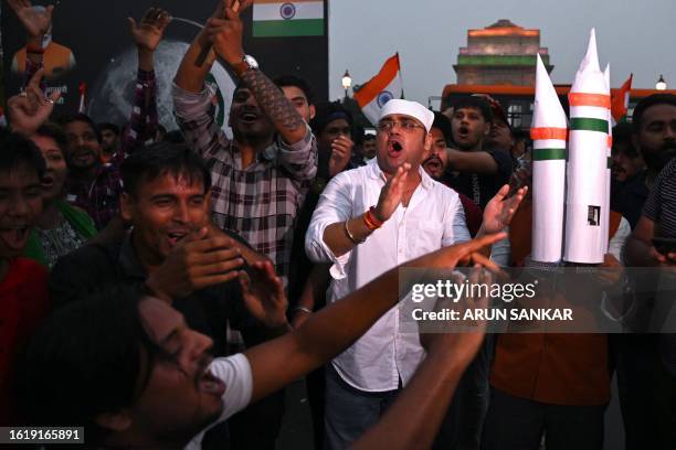 People celebrate the successful lunar landing of Chandrayaan-3 spacecraft on the south pole of the Moon, in New Delhi on August 23, 2023. India...