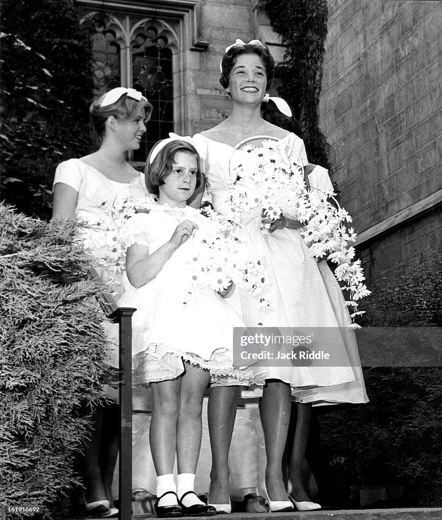MAY 30 1960, MAY 31 1960; Waiting for their cue to enter the chapel are two of the bridesmaids Miss 