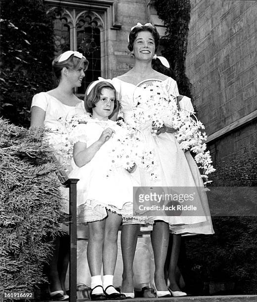 Waiting for their cue to enter the chapel are two of the bridesmaids Miss Edith Fenton of Wilmington, Del., Mrs. John Brooks Jr. Of Denver and the...