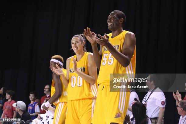 Player Ruth Riley and NBA Legend Dikembe Mutombo of the West All-Stars react to a play during the NBA Cares Special Olympics Unified Sports...