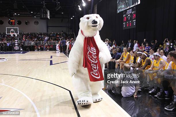 The Coca-Cola Polar Bear greets participants during the NBA Cares Special Olympics Unified Sports Basketball Game on Center Court at Jam Session...