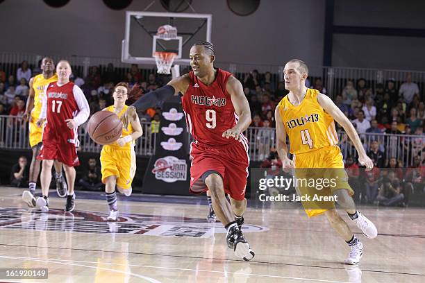 Legend Ron Harper of East All-Stars drives the ball against the West All-Stars during the NBA Cares Special Olympics Unified Sports Basketball Game...