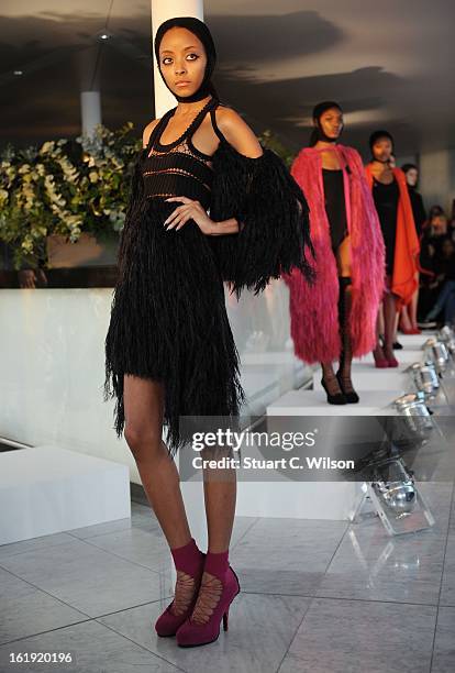 Models wear designs at the Mark Fast salon show during London Fashion Week Fall/Winter 2013/14 at ME Hotel on February 17, 2013 in London, England.