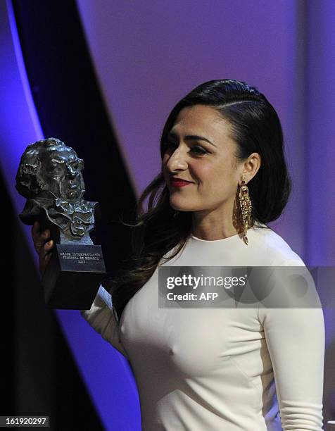 Spanish actress Candela Pena holds her trophy after winning the Goya award for best supporting actress for her role in the film "Una pistola en cada...