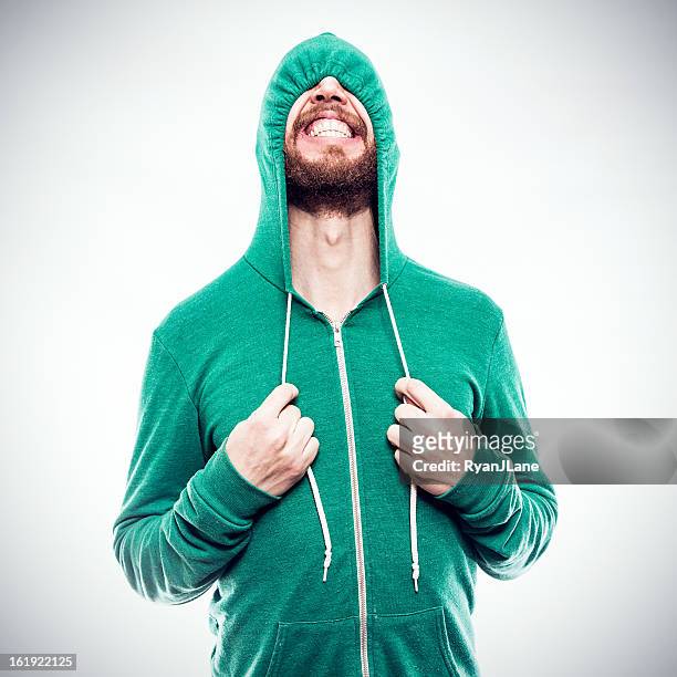 hooded sweatshirt hide and seek - awkward stockfoto's en -beelden