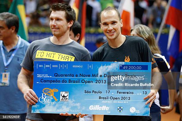 Alexander Peya from Austria and Bruno Soares from Brasil pose for a photo after winning the double final match against Frantisek Cermak from Czech...