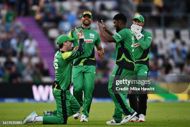 Finn Allen of Southern Brave celebrates the catch to dismiss Benny Howell of Birmingham Phoenix with his teammates during The Hundred match between...