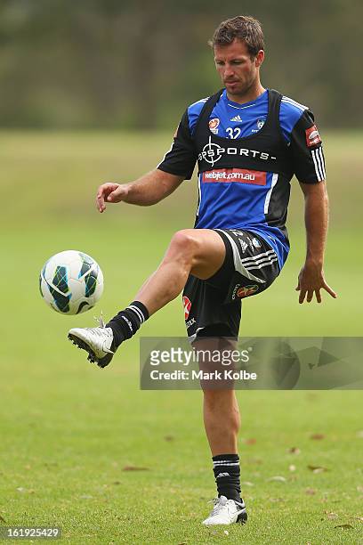 Lucas Neill kicks during a Sydney FC A-League training session at Macquarie Uni on February 18, 2013 in Sydney, Australia.