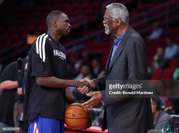 Luol Deng of the Chicago Bulls and the Eastern Conference talks with NBA legend Bill Russell before the 2013 NBA All-Star game at the Toyota Center...