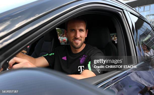 Bayern Munich's English forward Harry Kane sits in his new car during a sponsoring event at the German car manufacturer Audi in Ingolstadt, southern...