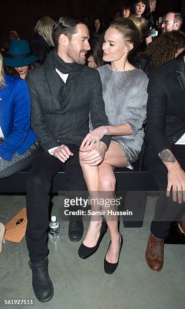 Michael Polish and Kate Bosworth attend the Topshop Unique show at the Tate Modern during London Fashion Week Fall/Winter 2013/14 on February 17,...