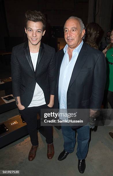 Louis Tomlinson from One Direction and Philip Green attend the Topshop Unique show at the Tate Modern during London Fashion Week Fall/Winter 2013/14...