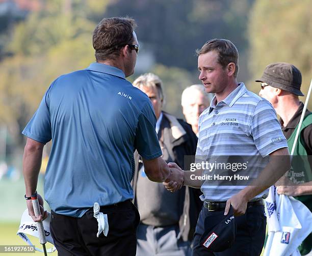 John Merrick receives a handshake from Charlie Beljan for his win on the second playoff hole during the final round of the Northern Trust Open at the...