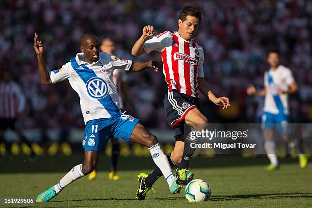 Damarcus Beasley of Puebla fights for the ball with Erick Torres of Chivas during a match between Puebla and Chivas as part of the Clausura 2013 at...