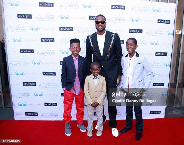 Dada Morris, Zion Wade, Dwyane Wade and Zaire Wade attend D. Wade's Apollo Jets All Star Luncheon on February 16, 2013 in Houston, Texas.