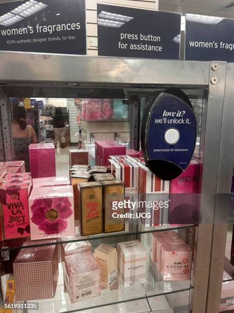 Locked Luxury Perfume display, press button for assistance, TJMaxx Store, Queens, New York.