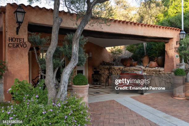 Car sits near the entrance to the historic Hotel Cervo located in the main square of Porto Cervo in Costa Smeralda on August 16, 2023 in Porto Cervo,...