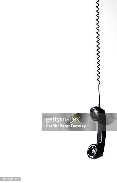 hanging black phone with copy space - cordon photos et images de collection